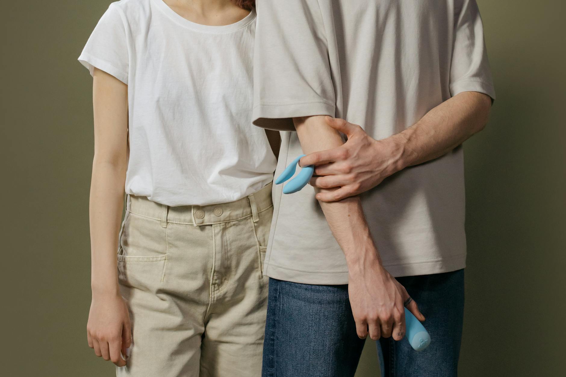 Woman holding clitoral vibrators, representing solutions for medication-related sexual side effects